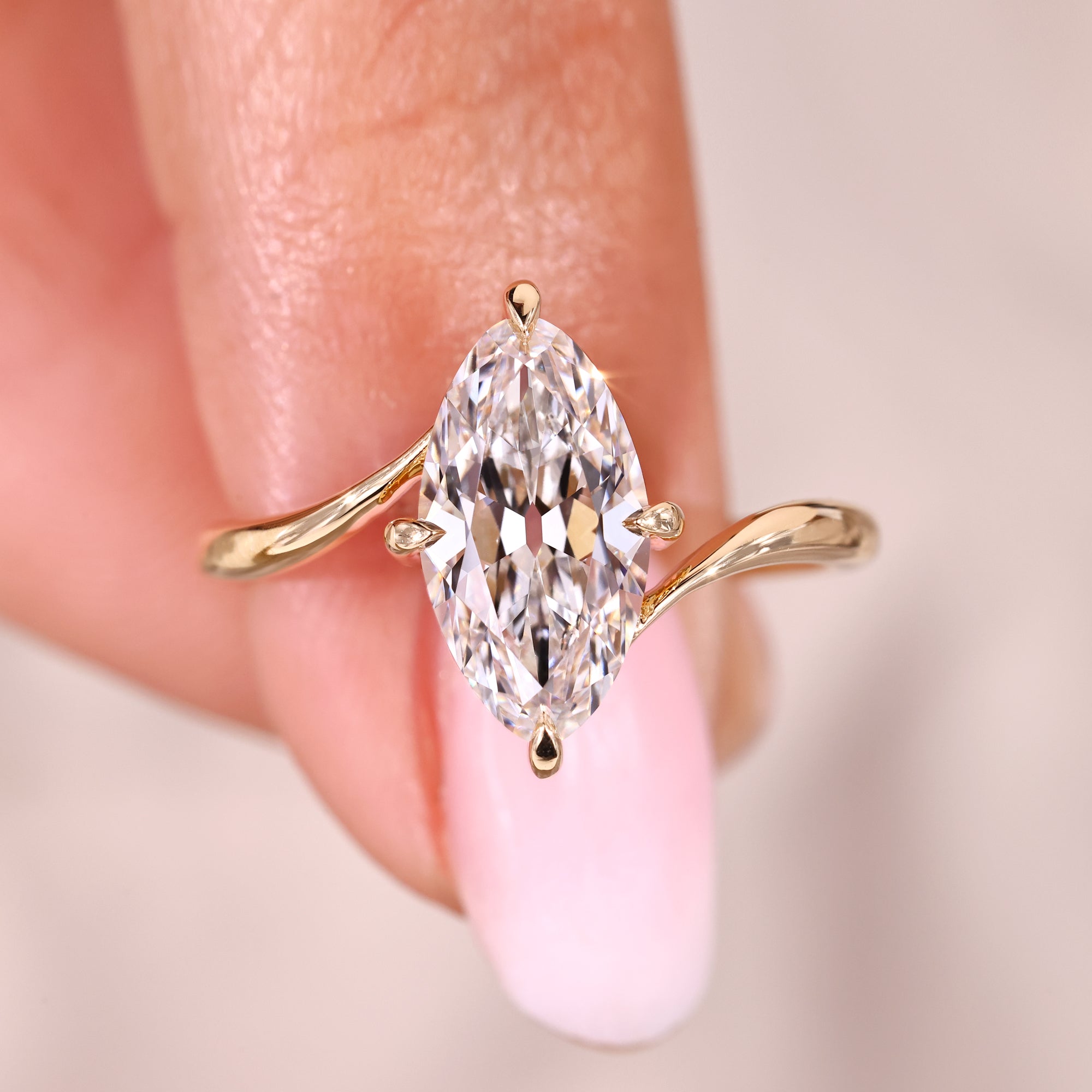 Solitaire diamond ring with marquise old European cut.