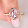 Oval rose cut solitaire diamond ring in bezel style.
