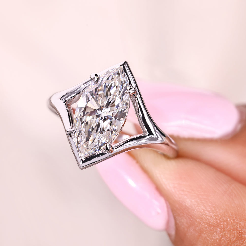 Marquise solitaire diamond ring with smooth split shank design
