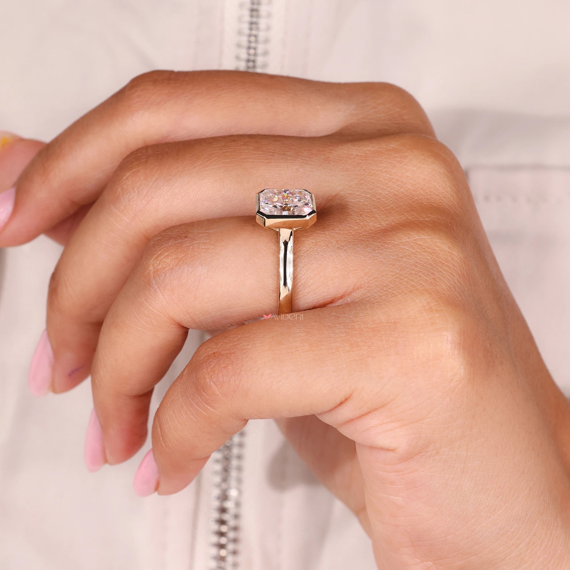 Moissanite engagement ring sparkles like a real diamond.