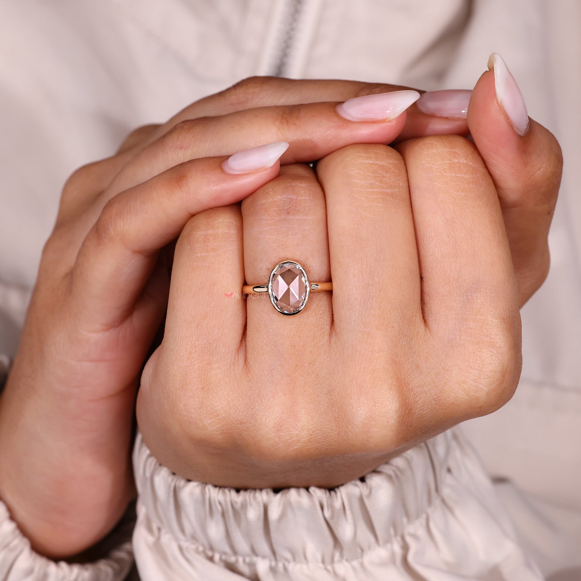 Minimal oval rose cut diamond ring with bezel.
