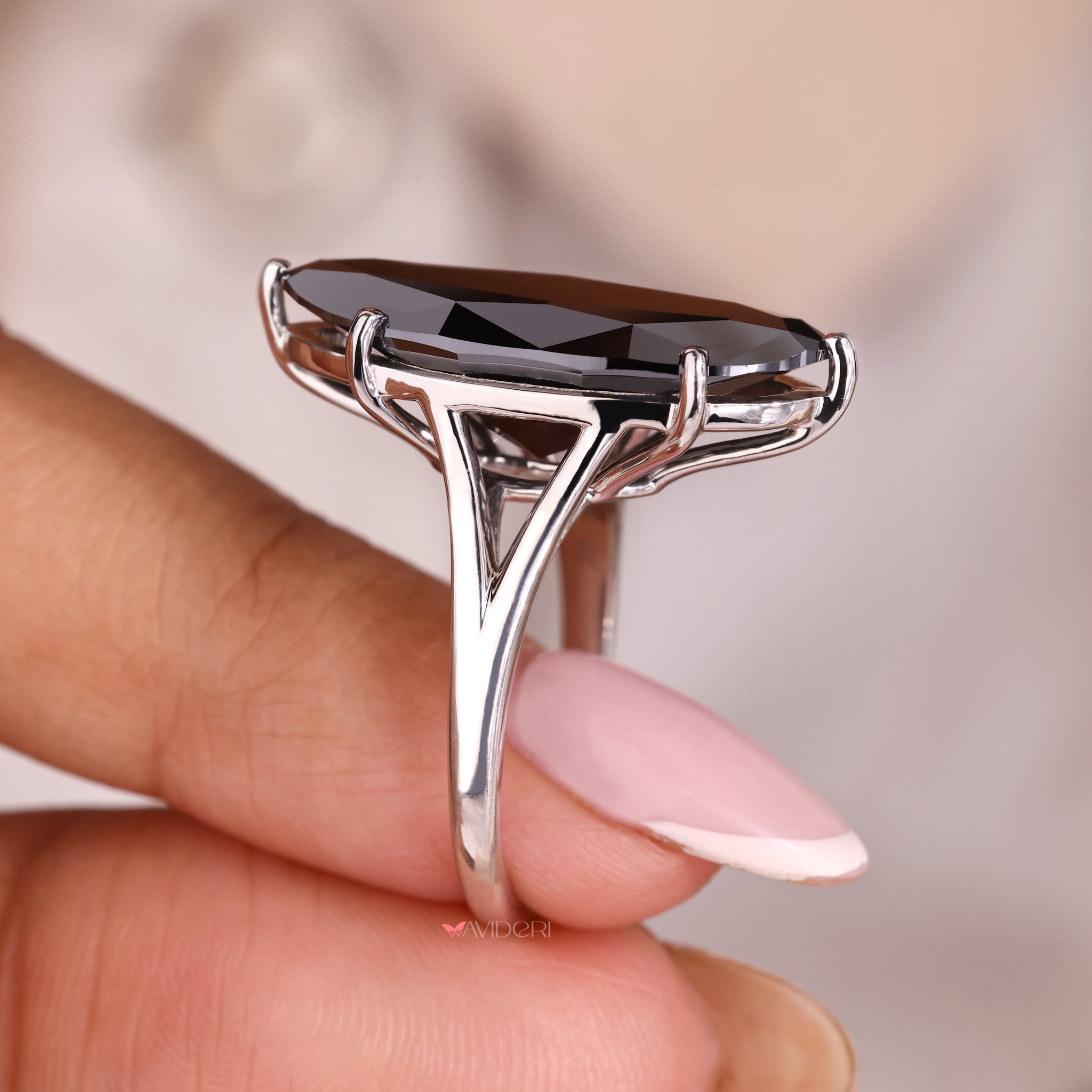 Solitaire moval cut ring set in a minimal band.
