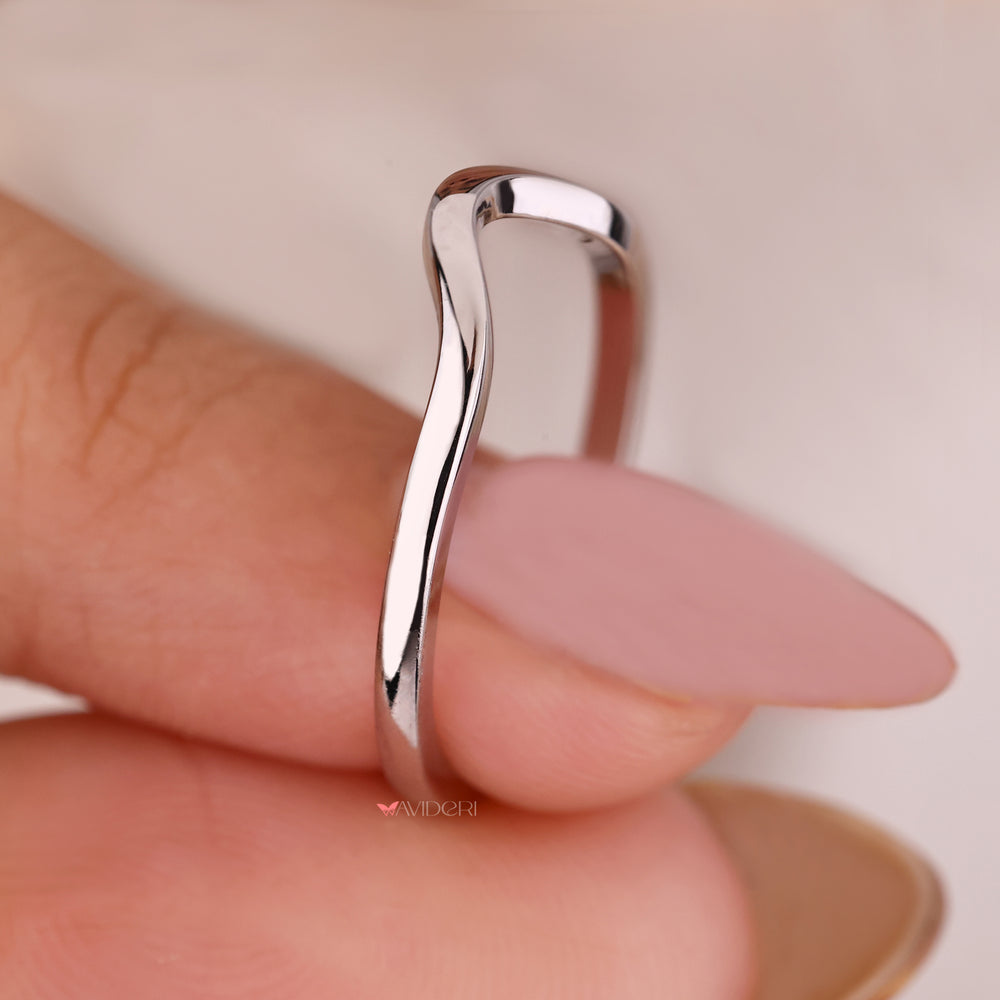 Curved wedding band designed to complement any engagement ring.