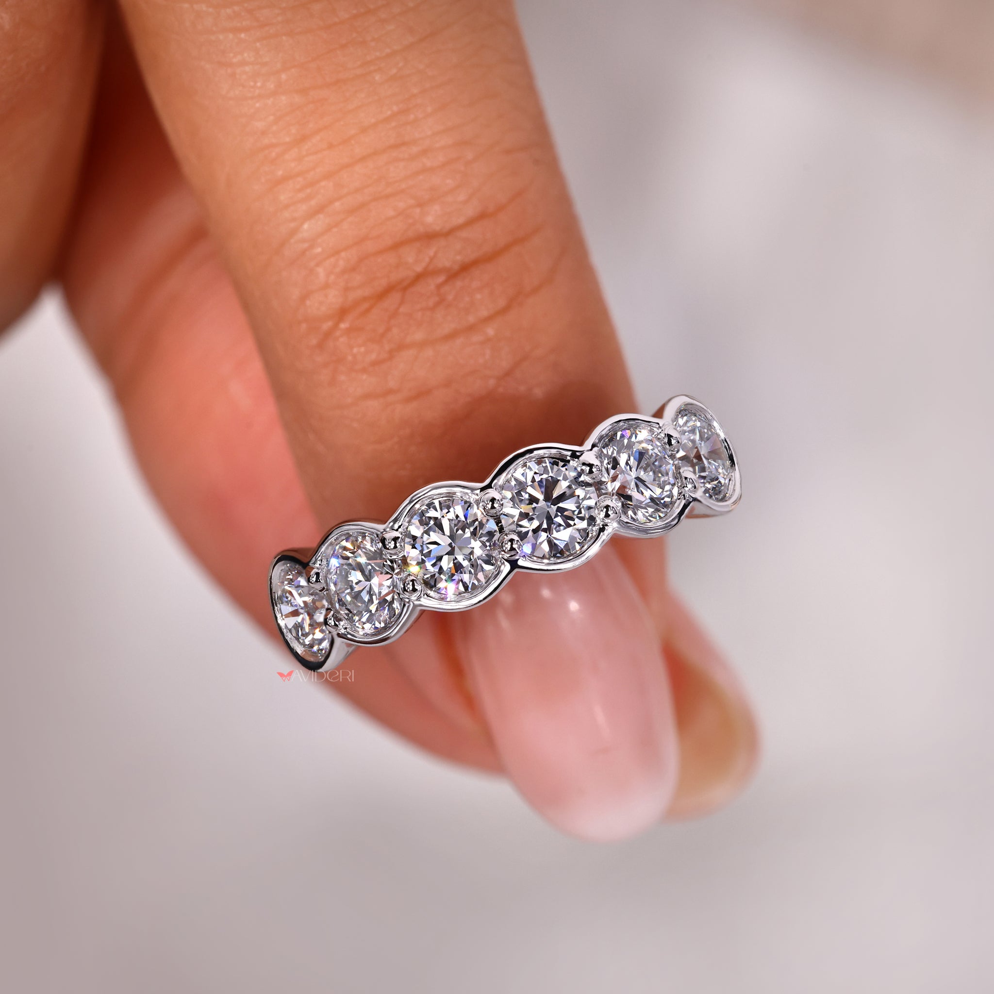 Half bezel set wedding ring with secure design.
