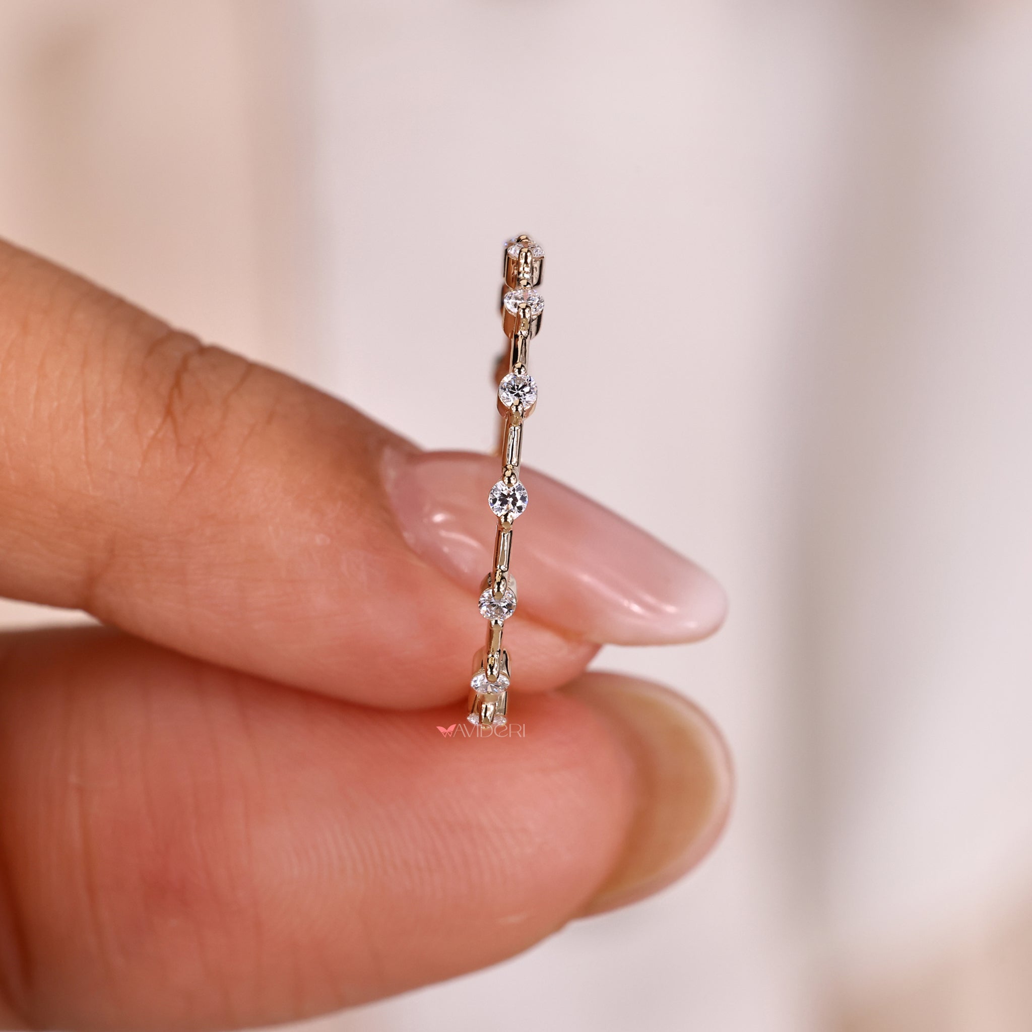 Yellow gold eternity band featuring round diamonds in a sleek design.
