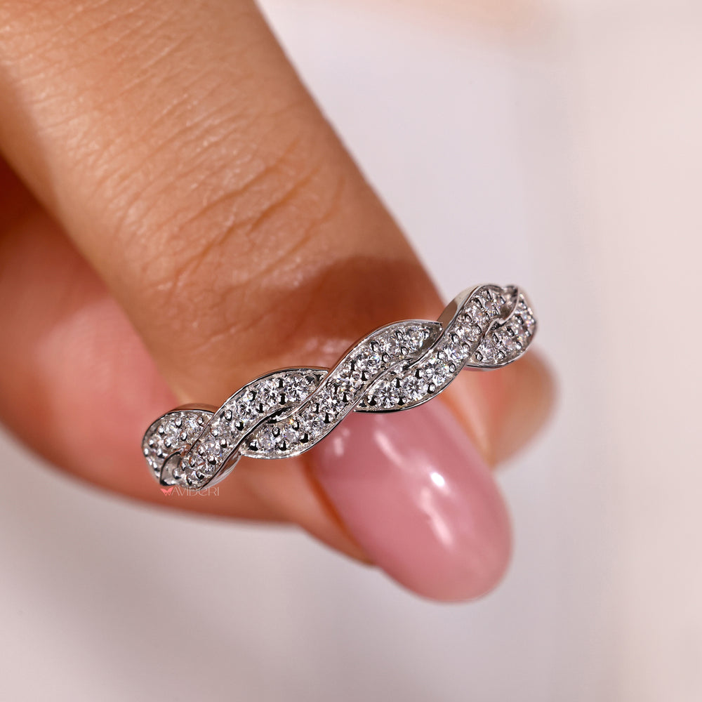 Unique white gold band with a creative twist.
