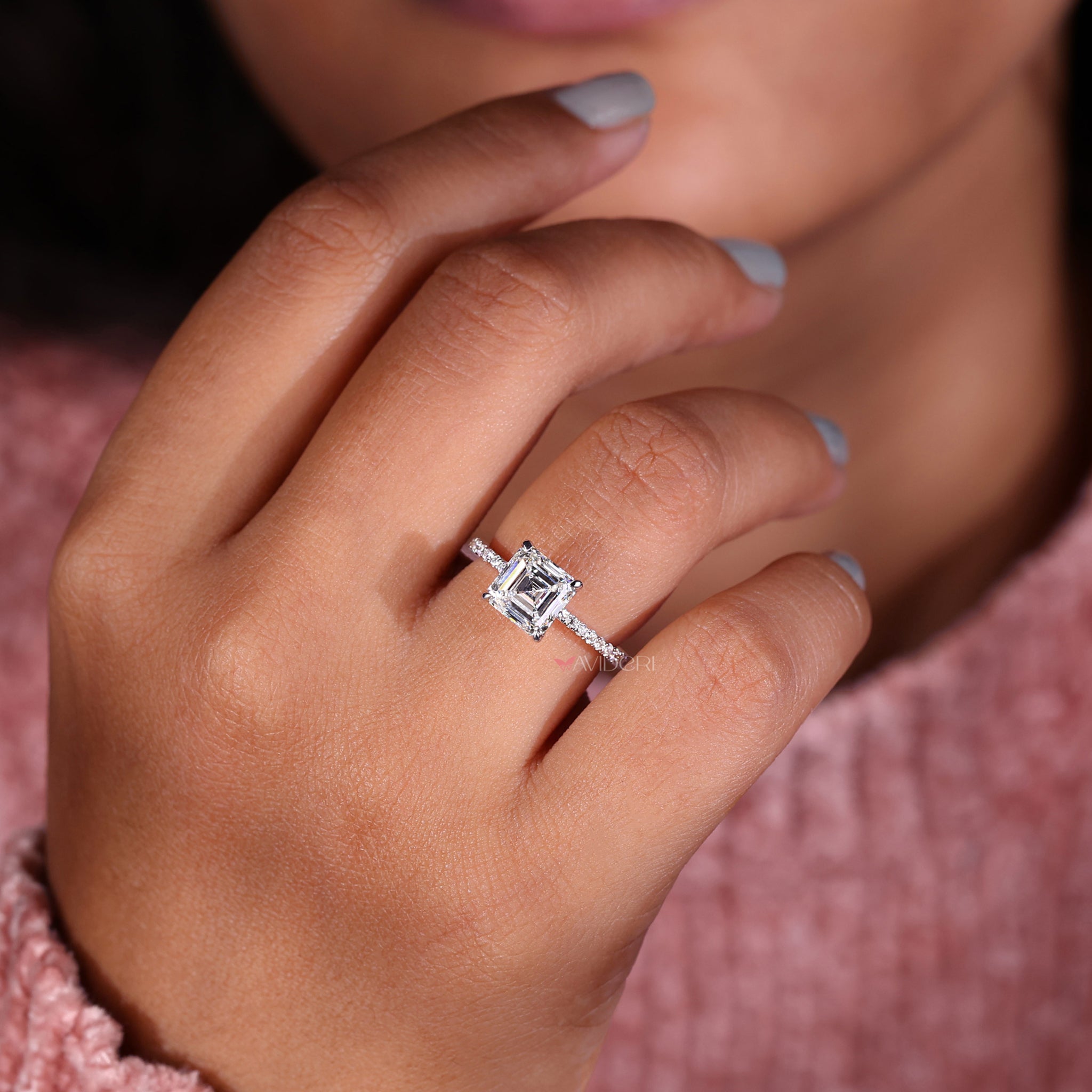 Prong setting Asscher diamond engagement ring with intricate pave detailing for an unforgettable proposal piece.
