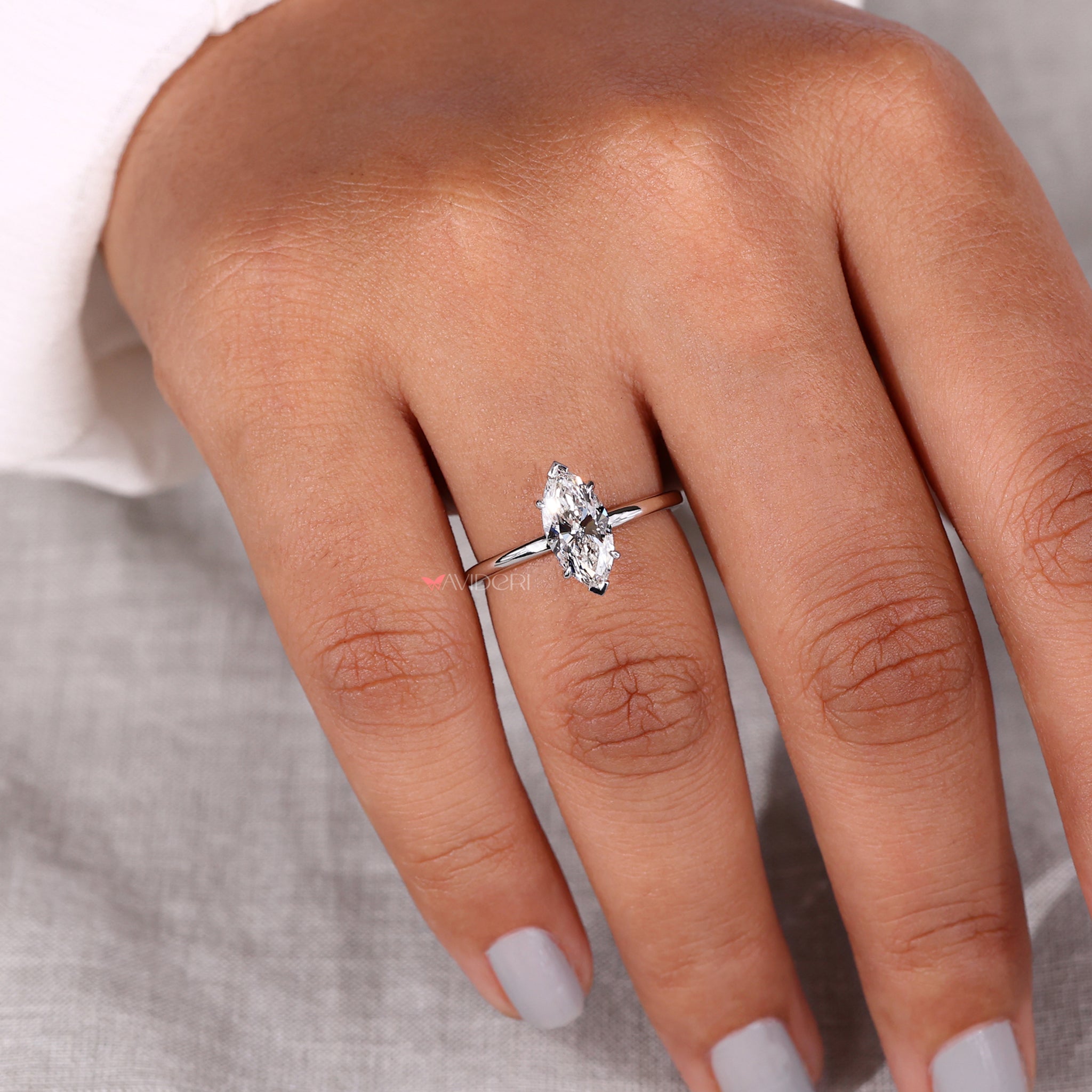 Handmade ring featuring marquise solitaire engagement ring style, designed with a durable and elegant v prong.
