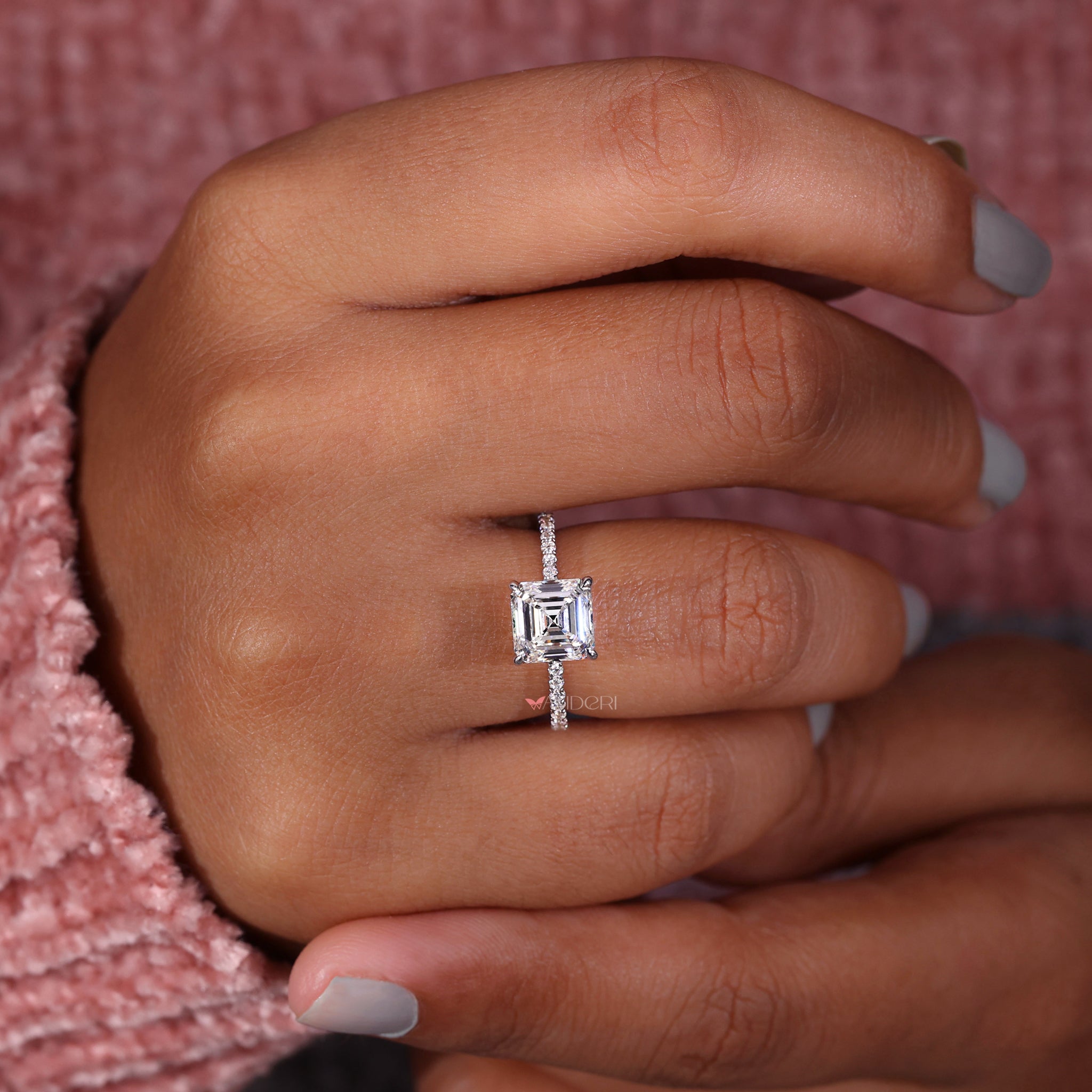 Handmade ring with asscher cut diamonds and a pave setting ring design, perfect for a sophisticated engagement.
