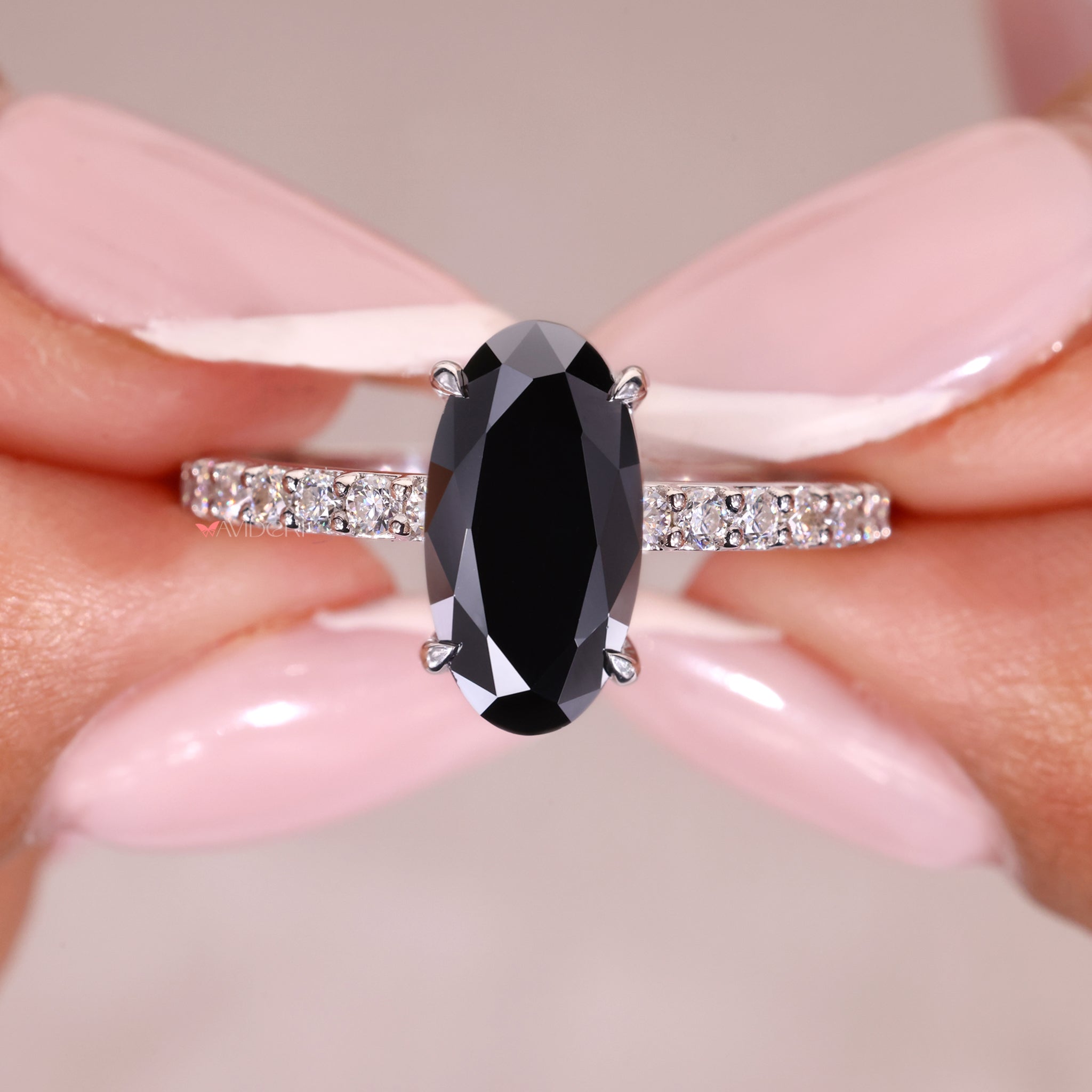 Movel shaped engagement ring with a delicate and modern design.
