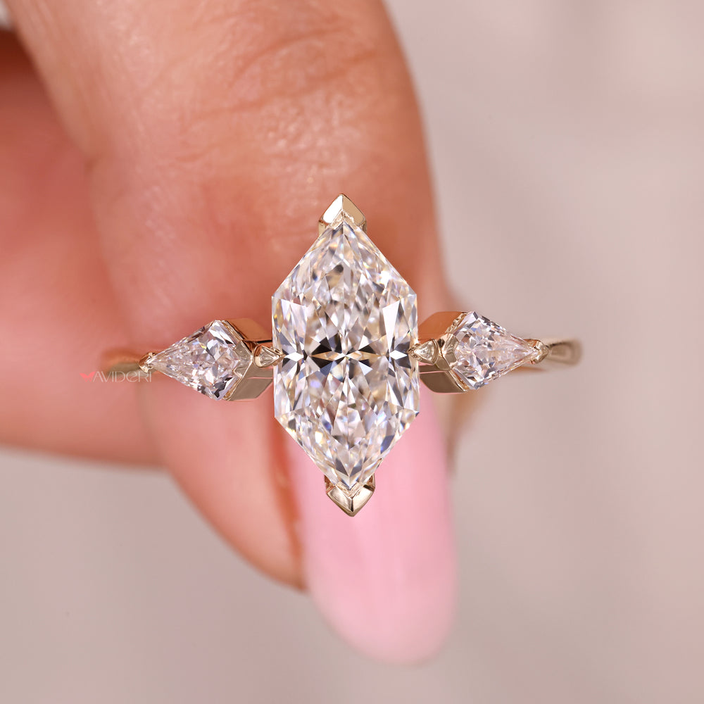 Three stone diamond ring with dutch marquise center.
