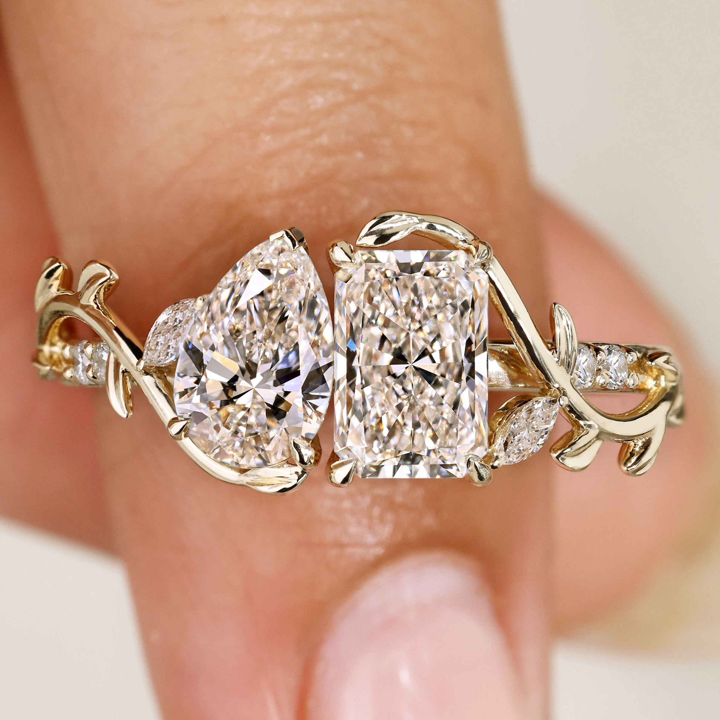 Toi et moi diamond ring with pear and radiant cuts.
