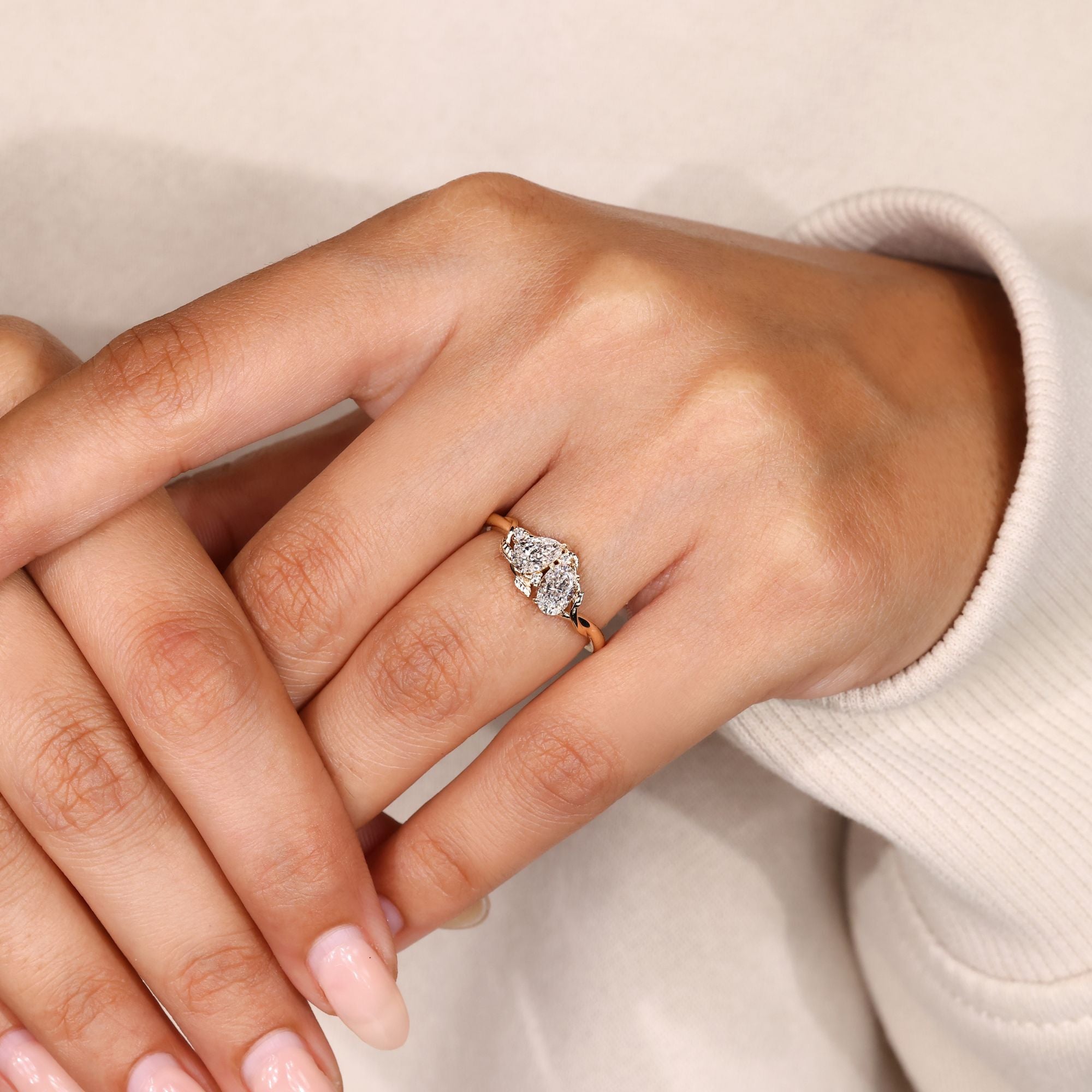 IGI certified pear and oval lab grown diamond ring.
