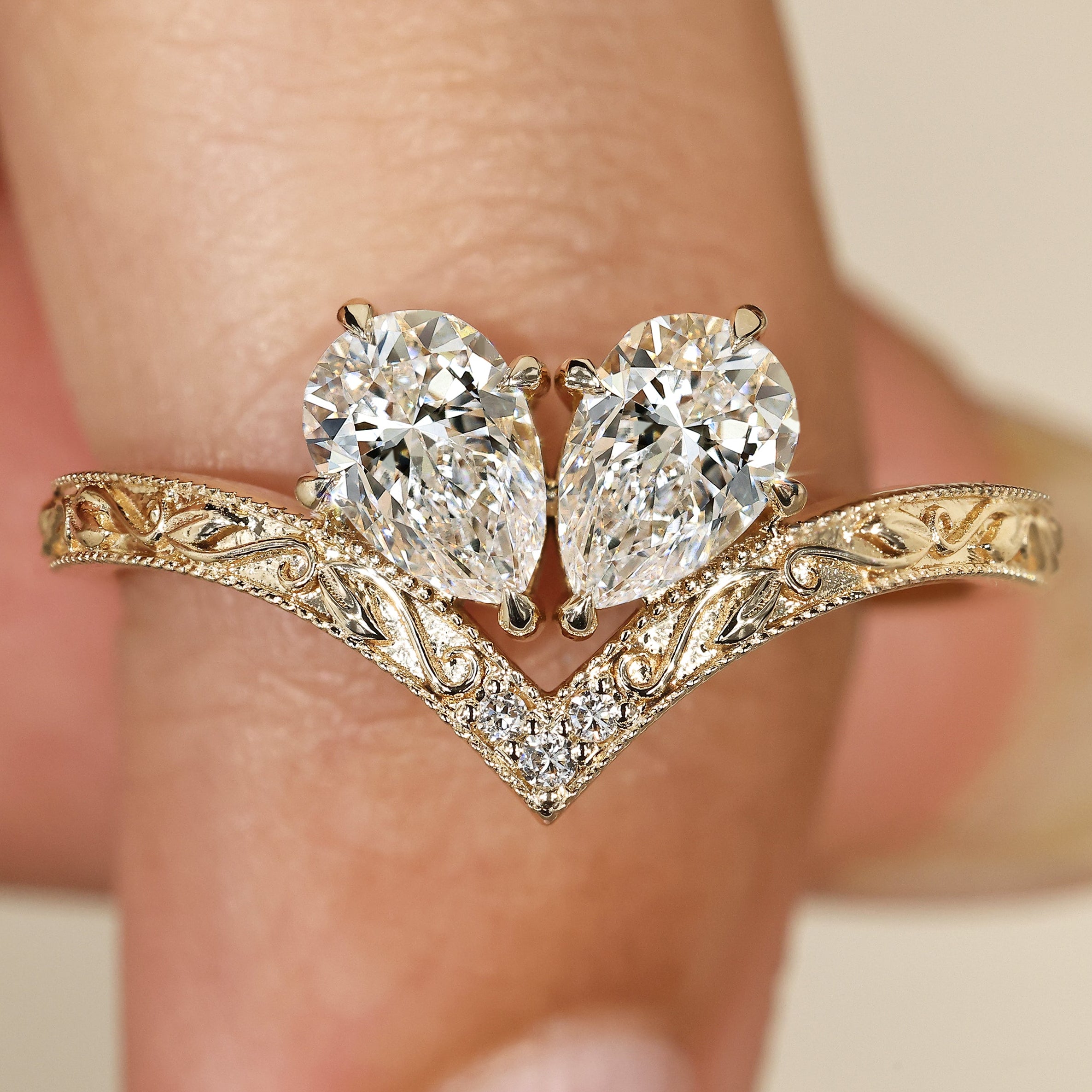 Toi et moi diamond ring with pear and round stones.
