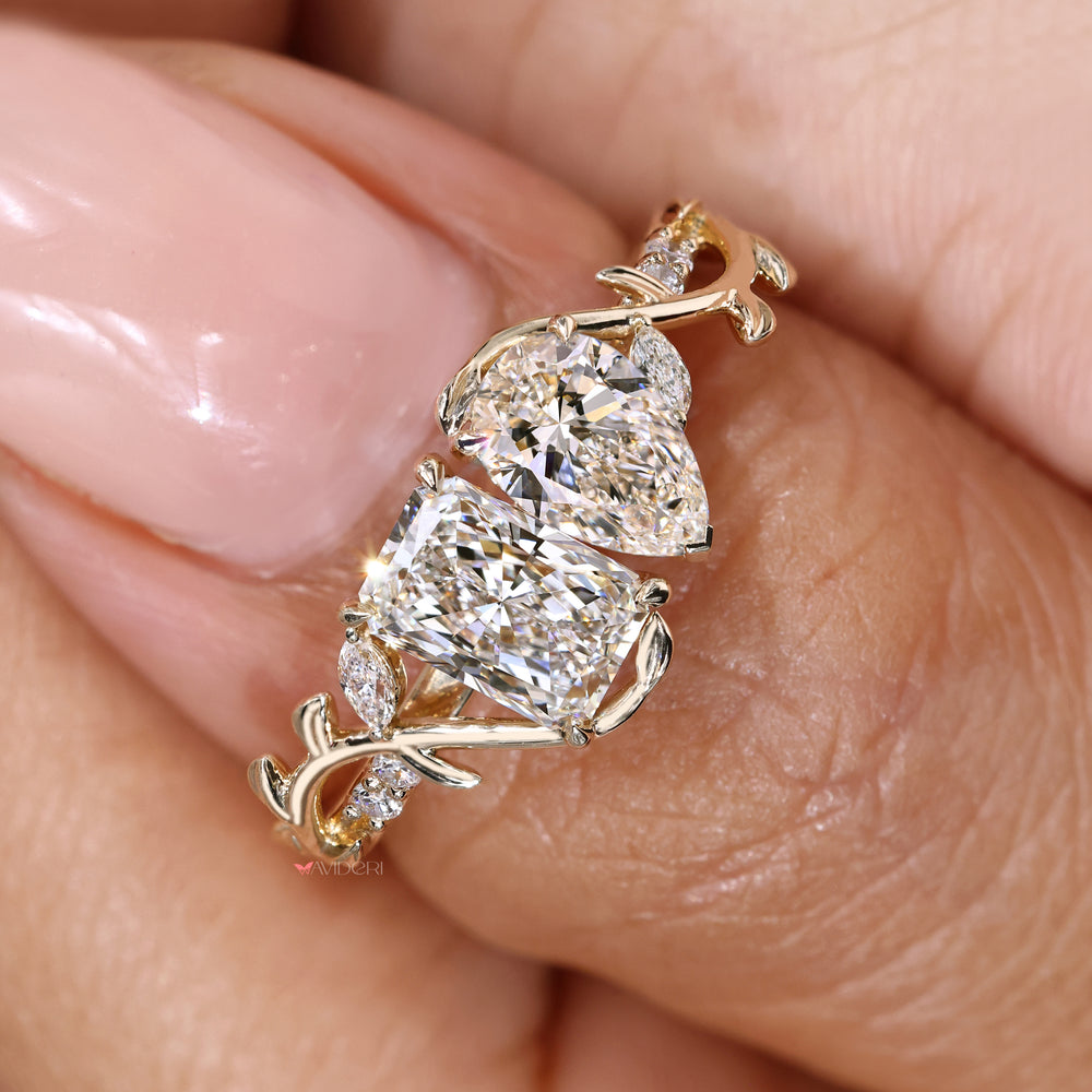 Toi et moi ring with pear and radiant diamonds.
