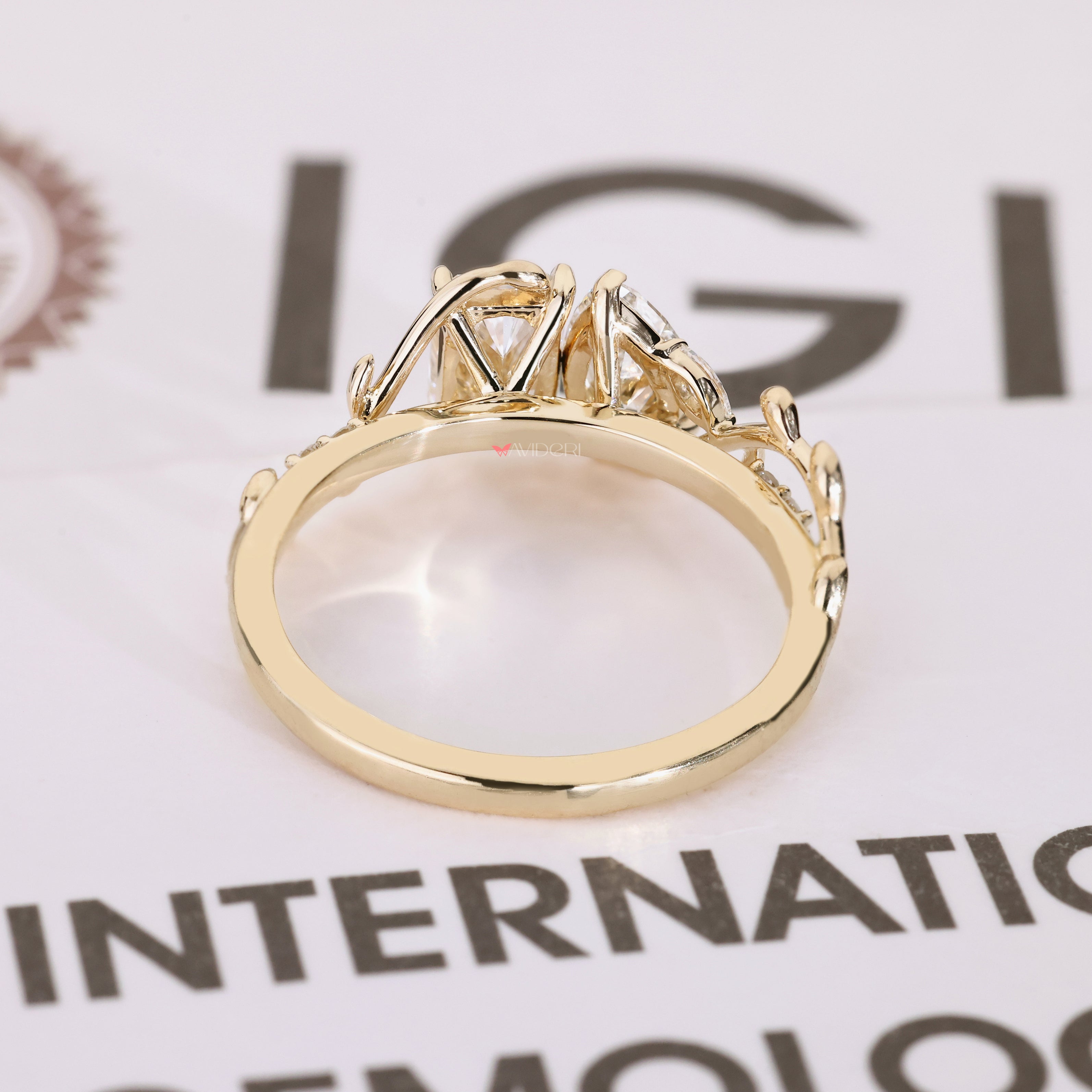 Toi et moi ring with marquise and round side stones.

