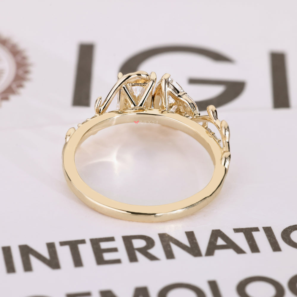 Toi et moi ring with marquise and round side stones.
