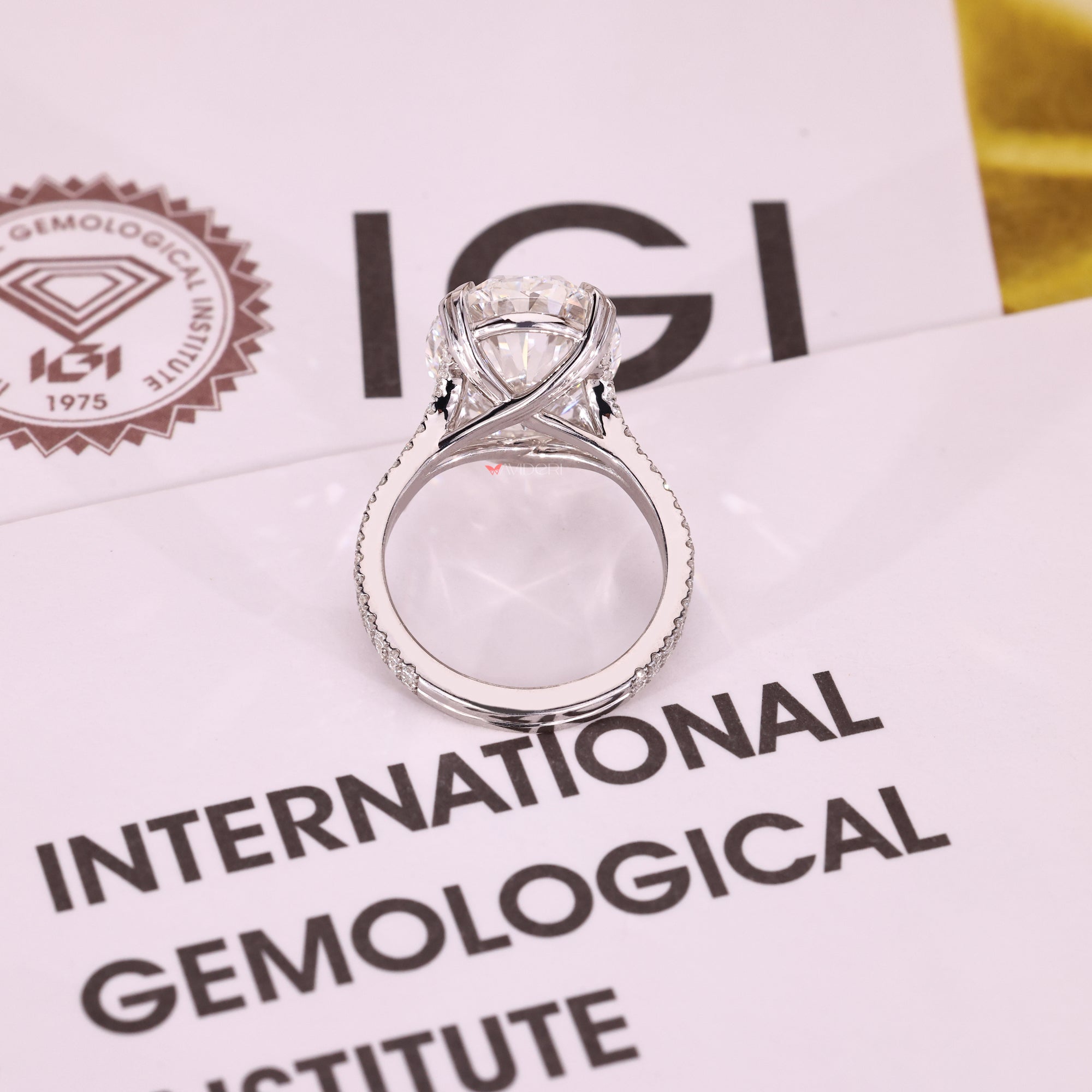 IGI certified oval diamond ring with cathedral setting style.