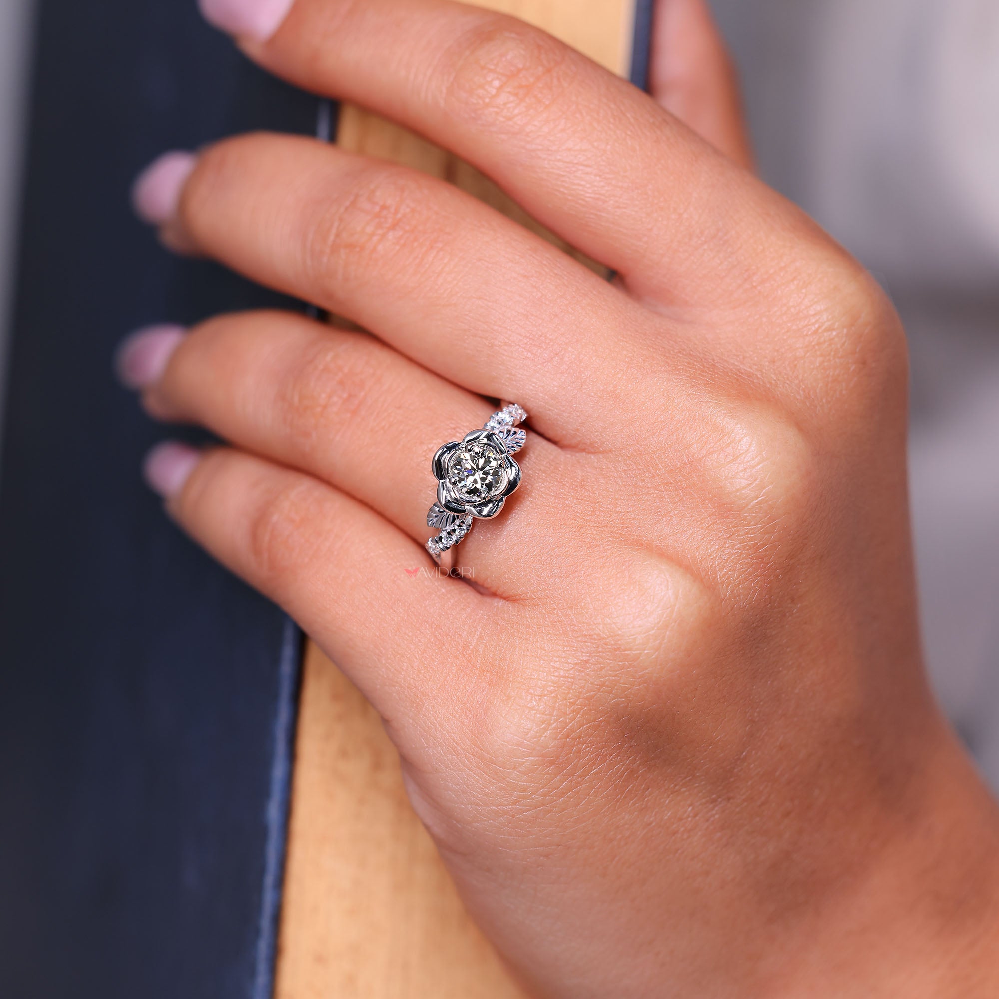 Nature-inspired round diamond engagement ring in white gold.
