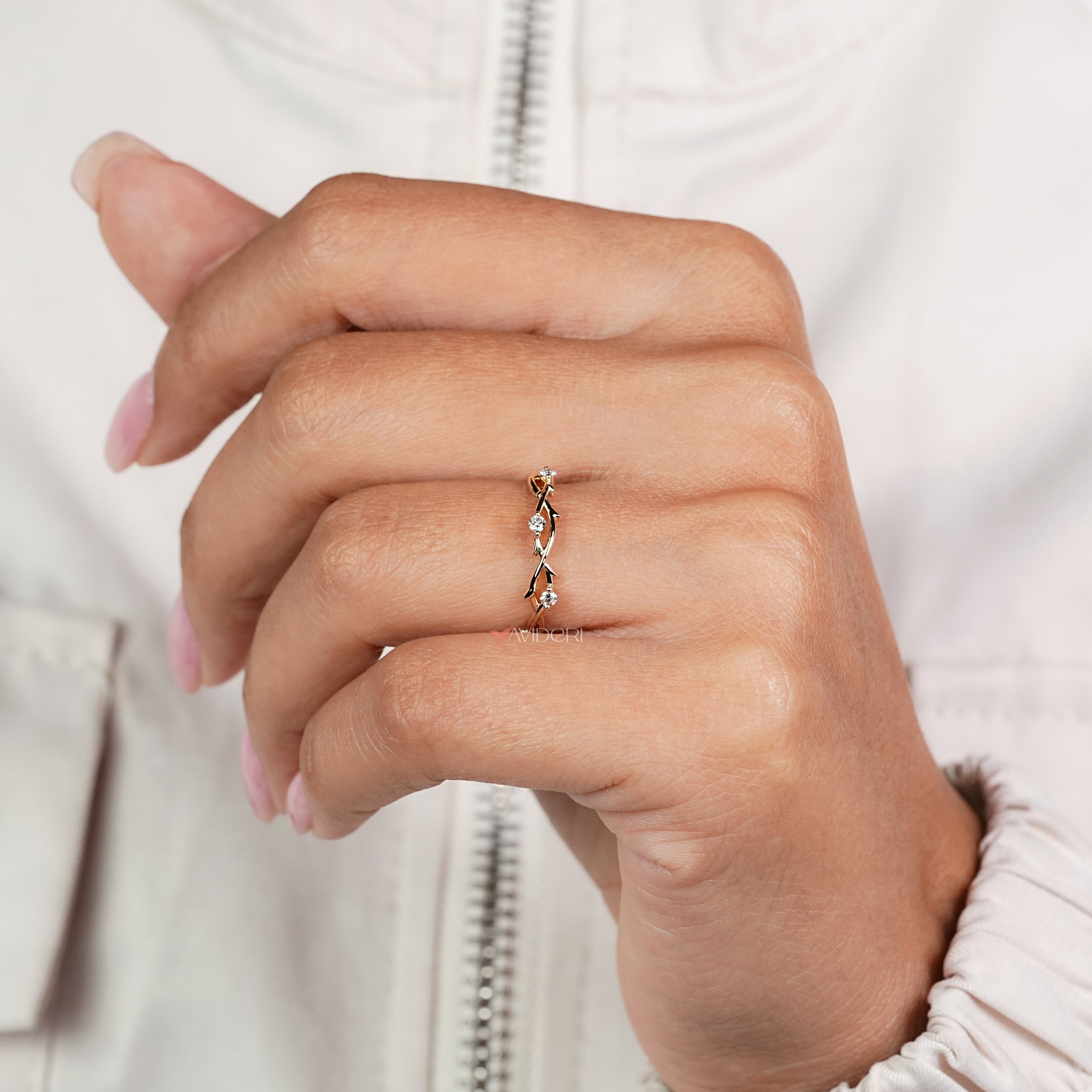 Twisted diamond wedding band with handcrafted leaf inspired details
