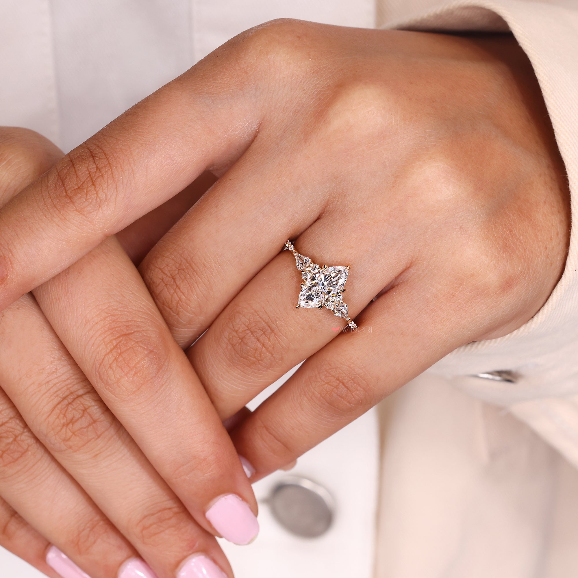 Round side diamond ring with prong setting.