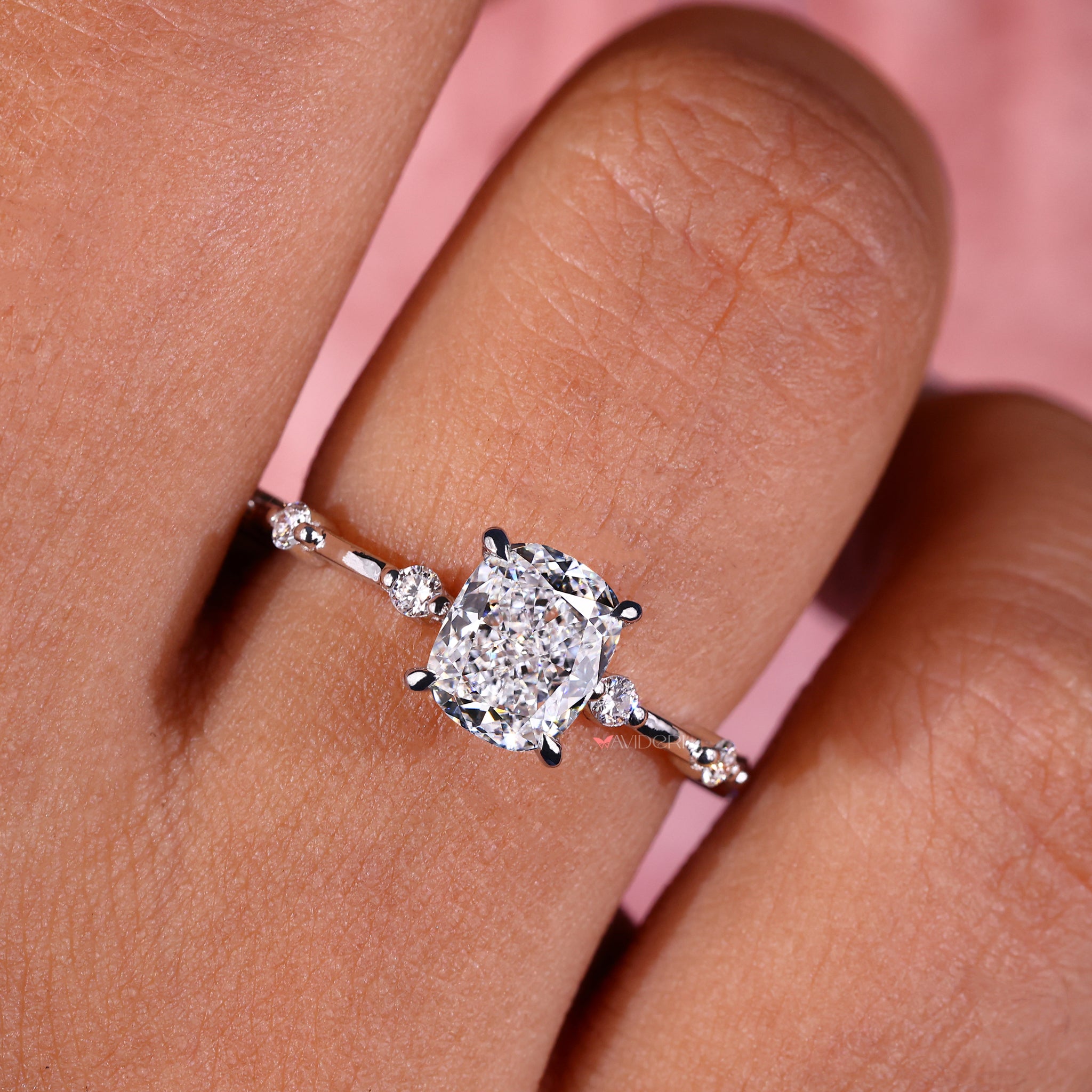 Handmade cushion cut ring showcasing an IGI certified Lab Grown Diamond with a claw setting for added durability.

