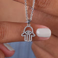 Hamsa Pendant Featuring Round Cut Moissanite
