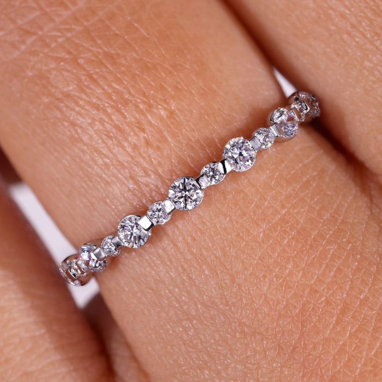 A stunning bezel wedding band featuring a minimalist design for everyday elegance.
