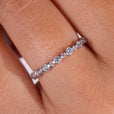 A stunning bezel wedding band featuring a minimalist design for everyday elegance.
