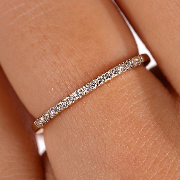 A thin diamond wedding band featuring micro pave diamonds, perfect for elegant weddings.
