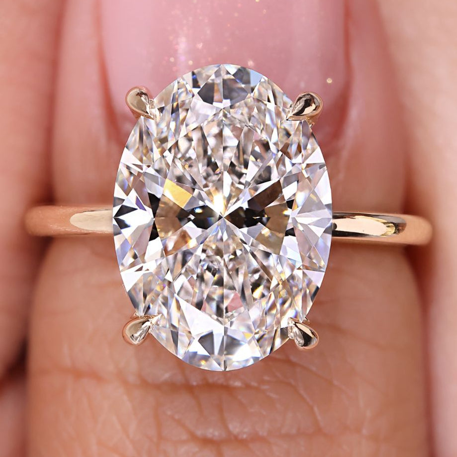 5 Carat Oval Cut Engagement Ring Solitaire Setting featuring a stunning oval diamond set in a yellow gold band.