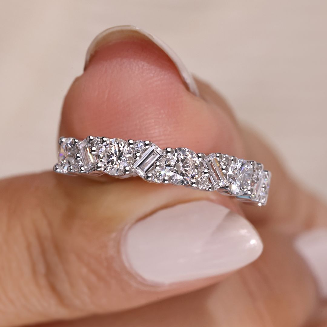 Baguette and round wedding band in white gold setting.
