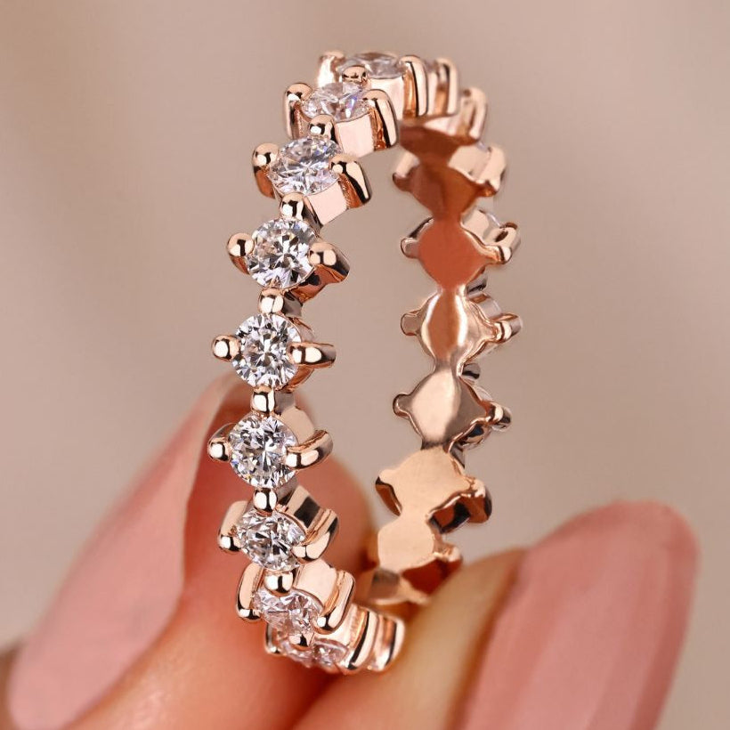 Shared prong wedding band with stunning diamond accents.
