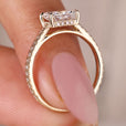 Cathedral setting engagement ring with radiant cut diamond.