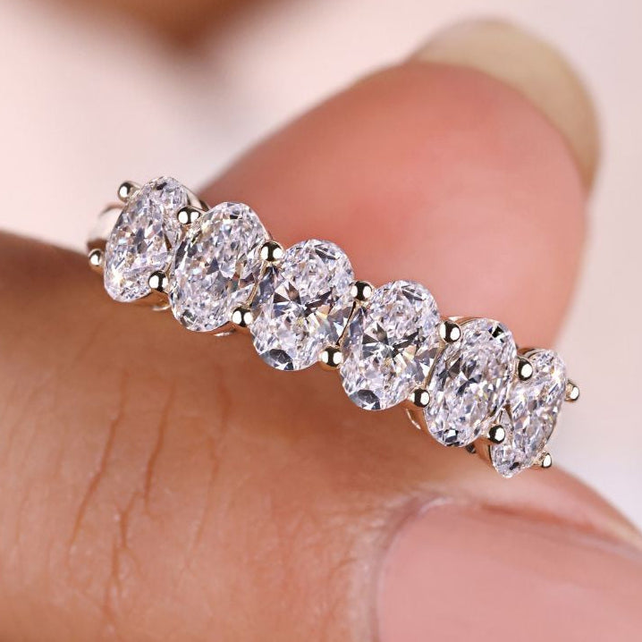 Oval diamond wedding band with a timeless sparkle.
