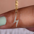 Lightning bolt pendant with a sleek, edgy design.