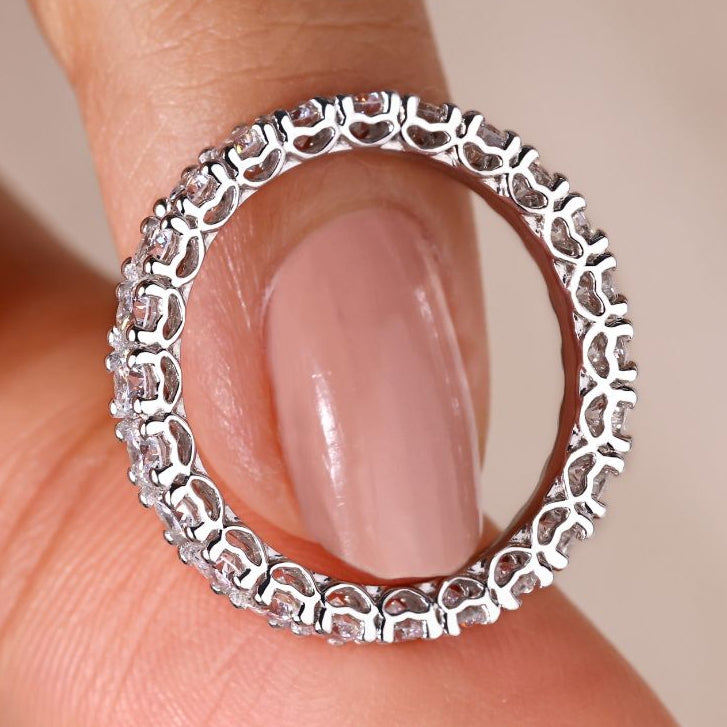 Round diamond eternity band set in elegant white gold.
