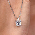 Princess cut pendant with a sharp, elegant design.