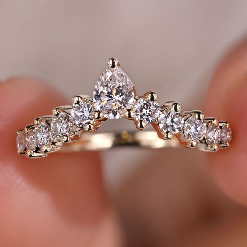 Pear shaped diamond band designed as a wedding band for pear shaped ring.
