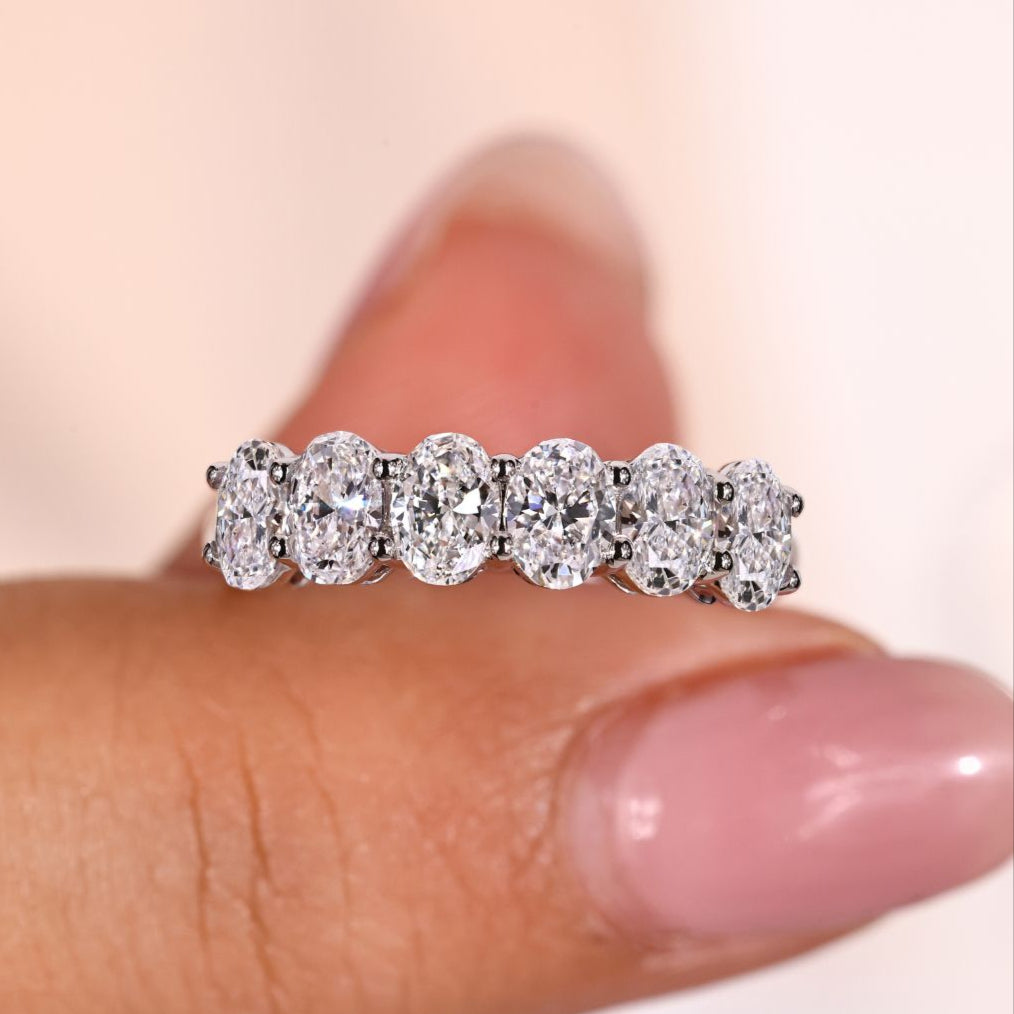 Oval wedding band crafted with six lab grown diamonds for elegance
