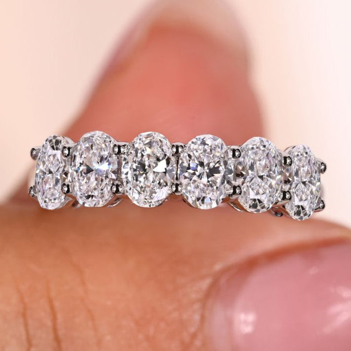 Oval wedding band crafted with six lab grown diamonds for elegance
