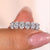 Oval wedding band crafted with six lab grown diamonds for elegance
