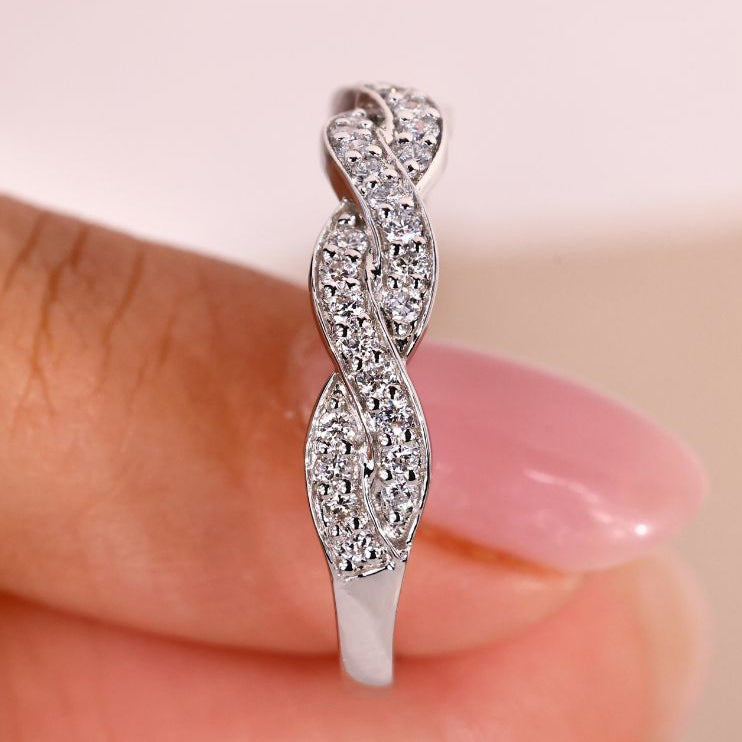 Twisted white gold wedding band with unique design.
