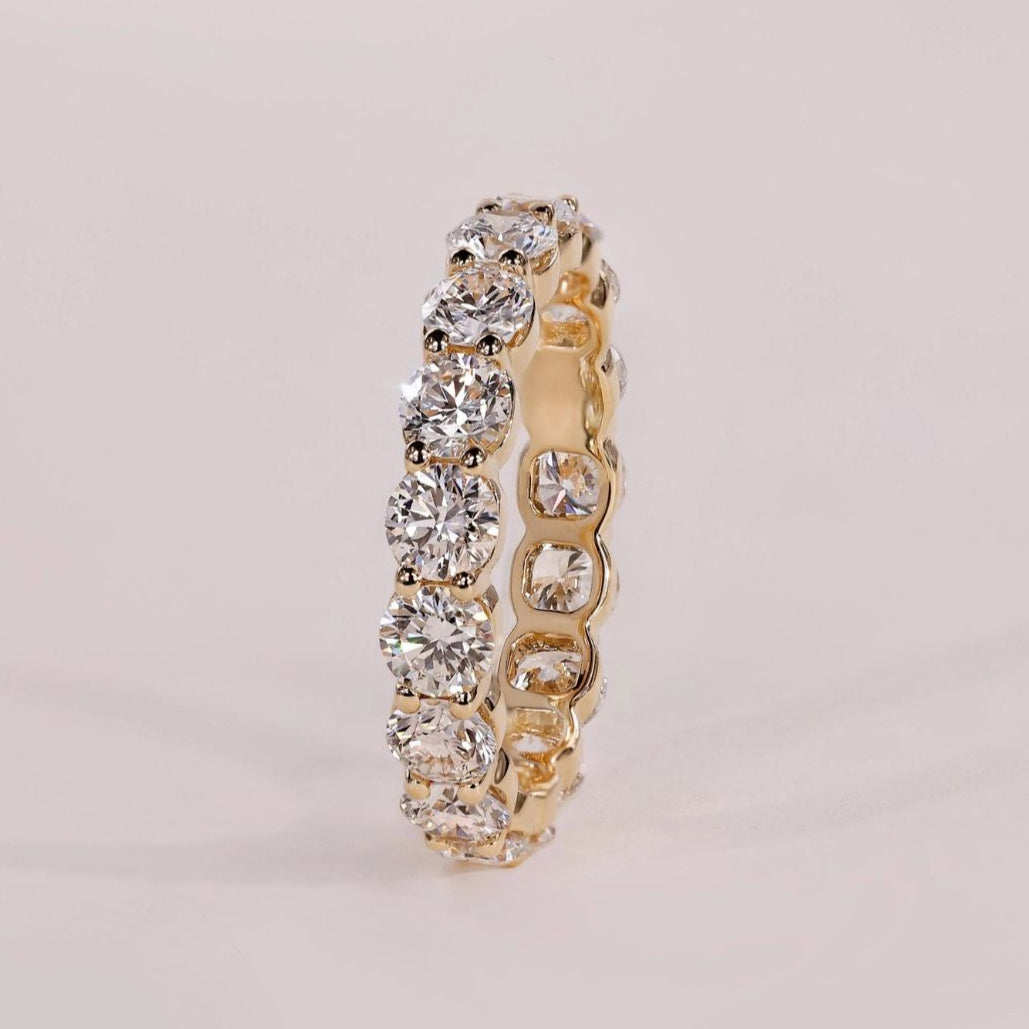 Elegant shared prong wedding band with a timeless design for lasting beauty.
