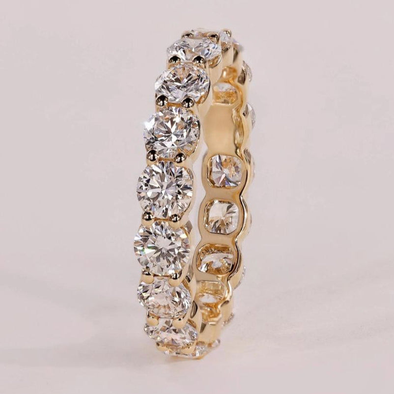 Elegant shared prong wedding band with a timeless design for lasting beauty.
