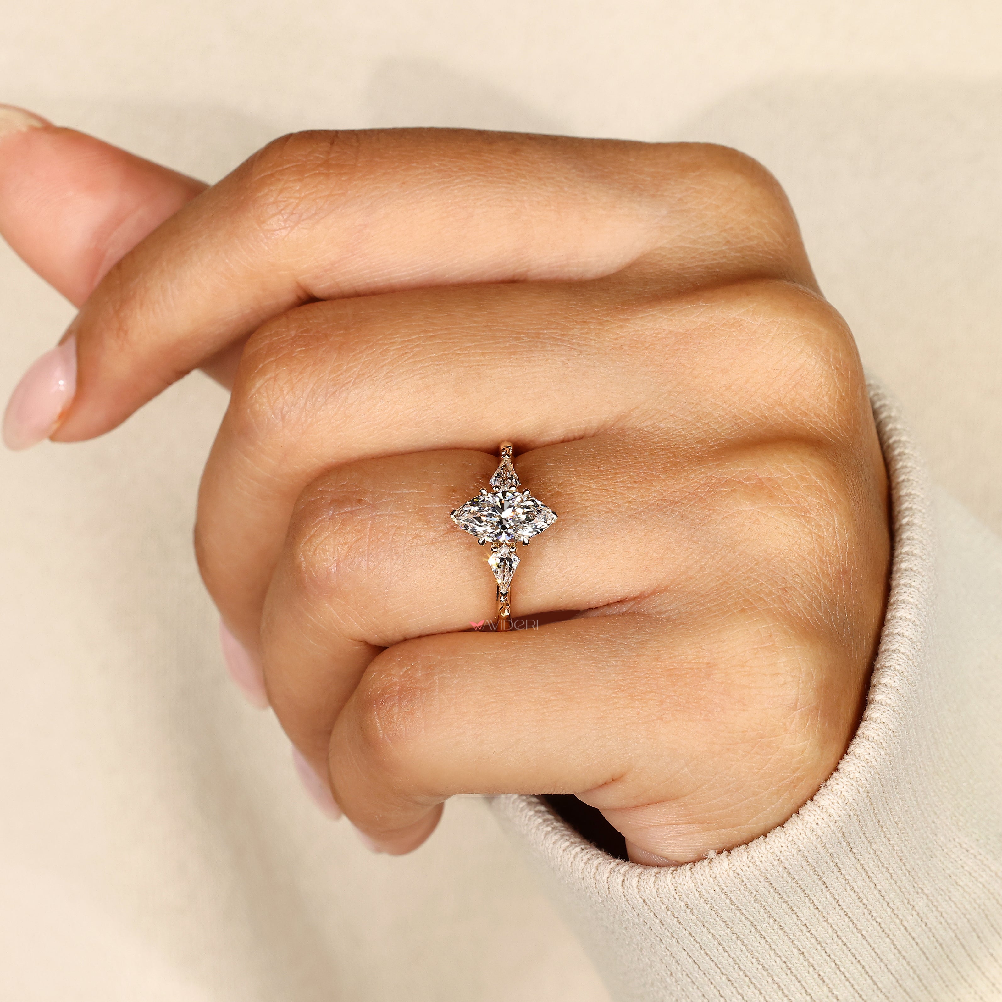 Three stone marquise ring with cathedral shank.
