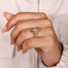 Hexagon diamond engagement ring with curved band.
