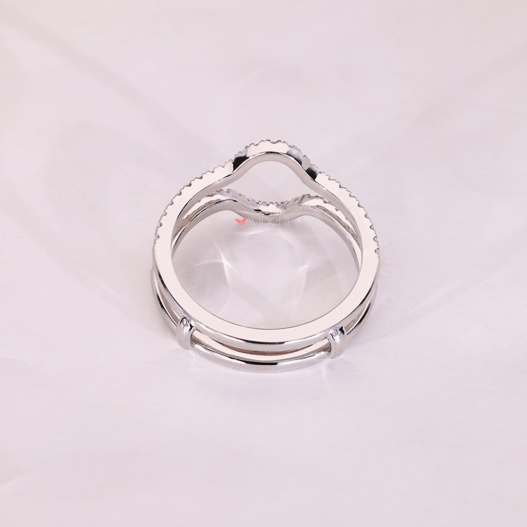 Handmade ring enhancer with round diamonds.
