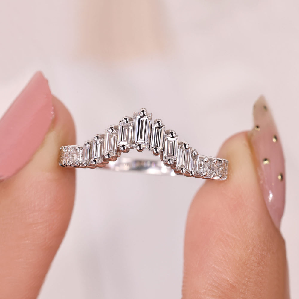 Curved wedding band with princess and baguette stones.
