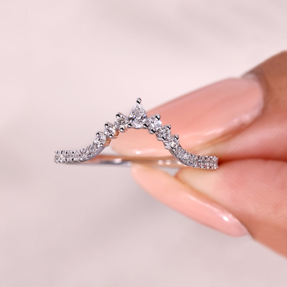 Handmade pear and round diamond chevron ring.

